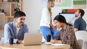 Collaboration, teamwork and strategy meeting for business colleagues sitting at a desk and working